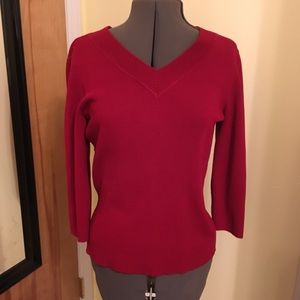 Jennifer Moore deep red sweater
